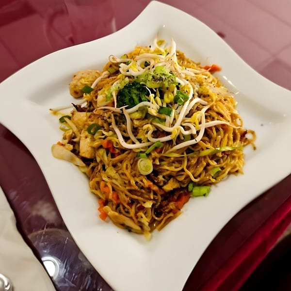 Thai Garden 1's Pad See Ew, a noodle dish with chicken, vegetables, and bean sprouts.
