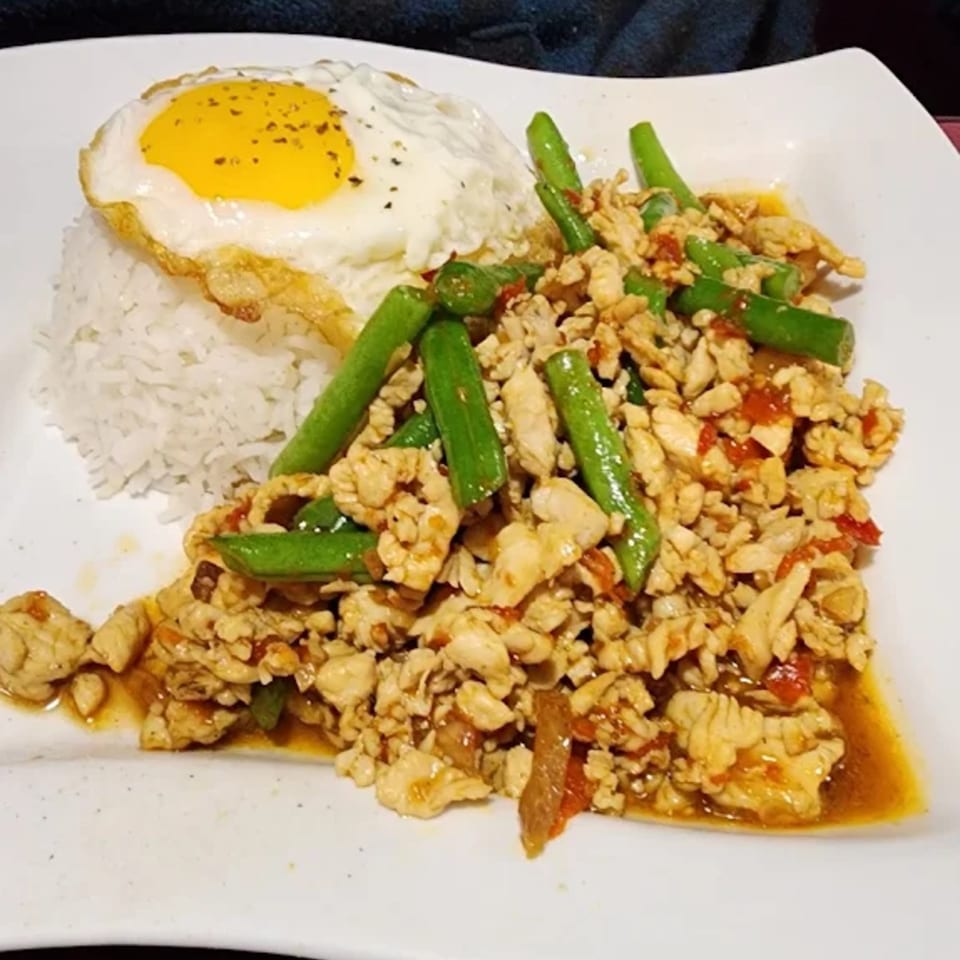 Thai Garden 1's Pad Krapow Gai, with minced chicken, green beans, rice, and a fried egg.